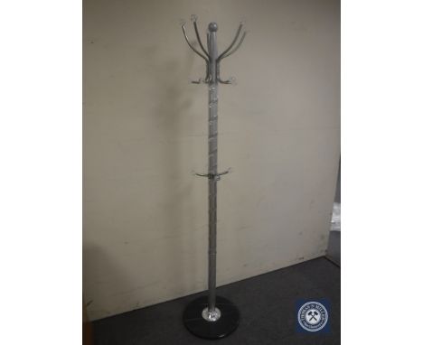 A hat and coat stand on a marble base 