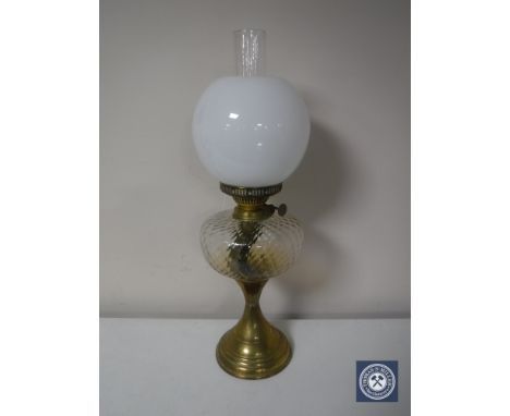 A Victorian brass Duplex oil lamp with chimney and shade, with glass reservoir 