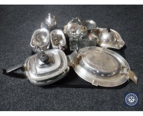 A tray of antique plated wares including muffin dish and cover, entree dish, three-piece Walker &amp; Hall tea service, cruet