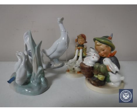 Three Nao figures of ducks together with two Hummel figures of a goose girl and a boy with rabbits