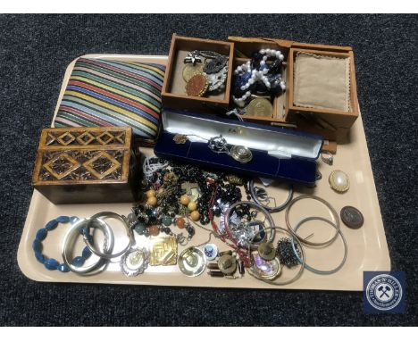 A tray of silver and costume jewellery, enamel bangles, coins etc