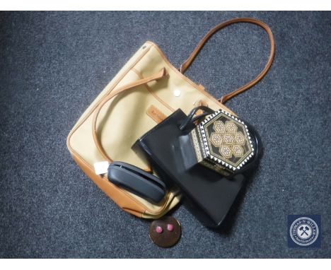 A Barbour canvas bag containing a leather handbag, glasses in case, Eastern trinket box and a compact
