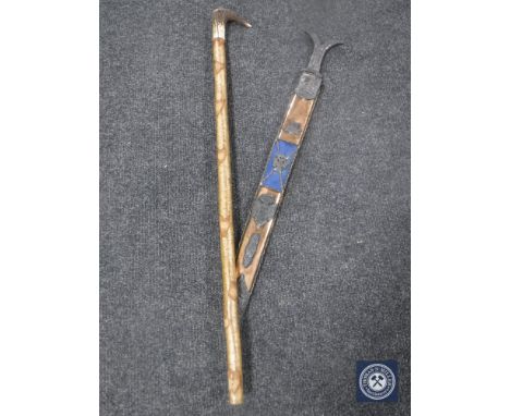 A Persian style sword in scabbard and a horn handled walking stick 