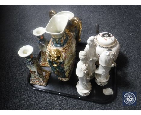 A tray of oriental wares including bamboo style teapot, two gilded vases of geisha and matching candlestick, three figures  