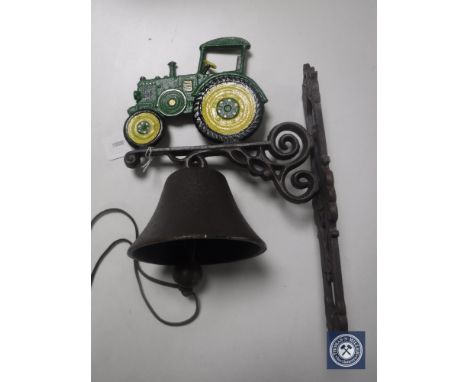 A cast iron tractor wall bracket with bell 