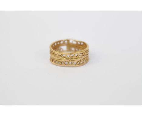 Openwork pierced Yellow metal ring (tests as 18ct). Size N. 3.9g total weight 