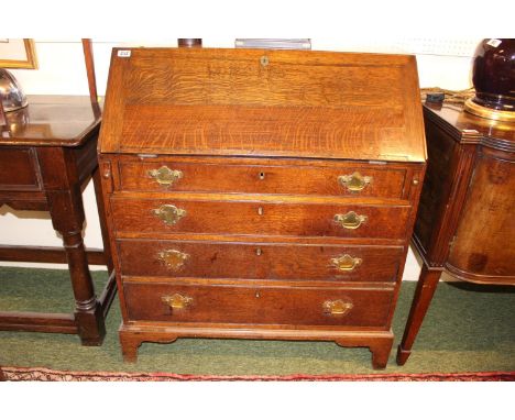 George III Oak Fall front Bureau with brass drop handles and fitted interior over bracket feet. 93cm in Width 