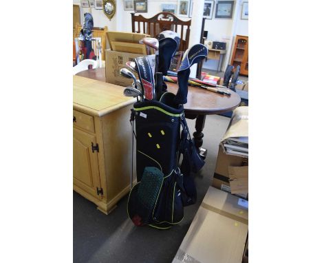 Golf caddy and a quantity of clubs