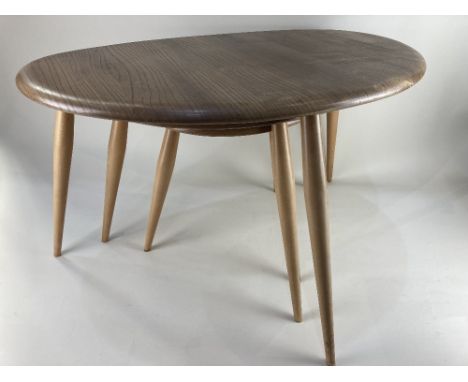 An Ercol style light elm 'pebble' nest of three tables, 65cm