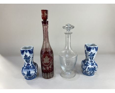 A pair of Delft blue and white porcelain vases, decorated with flowers and canal scenes, 20cm high, a Bohemian style cranberr