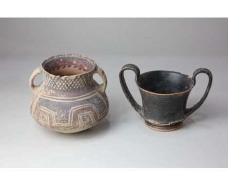 A Greek black glazed skyphos or cup, possibly Campanian c 300-260 BC, 11cm high including handles, together with a Chinese po