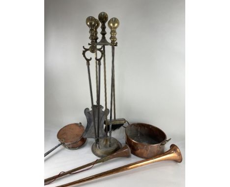 A copper chestnut roasting pan with pierced hinged cover, 60cm, an oval pan, two hunting horns and a brass fireside companion