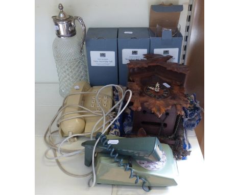 A cuckoo clock, plated and glass jug, vintage telephones and three Dowty commemorative glasses