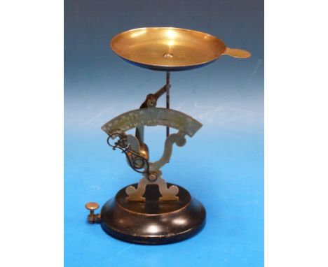 A set of Narcissi Braise Paris pendulum type postage scales, calibrated in both grams and ounces, on circular ebonised base