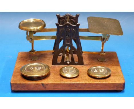 A set of possibly Setten & Durward postage scales, having Arts and Crafts / Arts Nouveau Archibald Knox inspired supports, on
