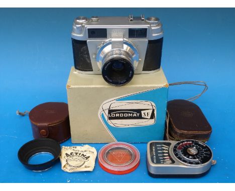 A Lordomat S E Rangefinder camera in box with instructions together with a Weston light meter and various filters etc