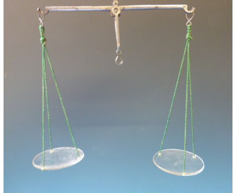 An oak cased set of travelling apothecary beam scales with weights 
