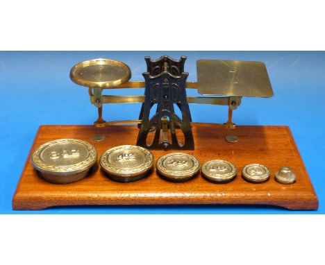 A set of possibly Setten & Durward postage scales, having Arts and Crafts / Arts Nouveau Archibald Knox inspired supports, on