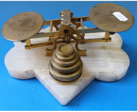 A set of Victorian letter scales on geometric white onyx base with shield-shaped plaque to front and weights behind