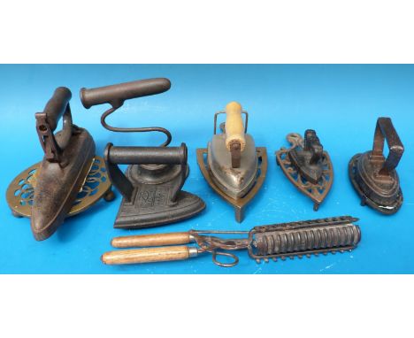 A quantity of vintage irons, trivets etc including a Silvester's patent round bottomed iron, etc 