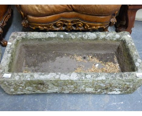 An oblong natural stone trough (length 82cm) 