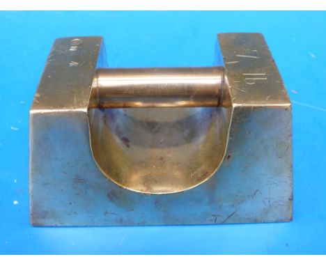 A 7lb brass bar weight with ministry broad arrow, PTC and 11 to top and Elizabeth II cypher to underside 