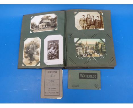 A vintage postcard album containing a collection of postcards Victorian onwards, including WW1 interest RHA, transport, comic