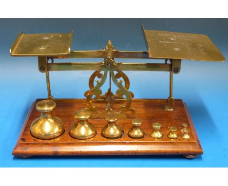 An set of John Heath Birmingham postage scales with postage rates to pan, the base with a run of eight bell shaped weights