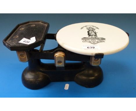 A set of cast iron shop scales with ceramic pan 