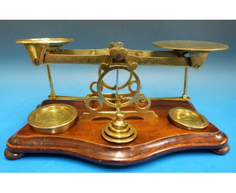 A set of possibly Mordan postage scales, the beams, frame and pans with floral and scrolling decoration having serpentine fro