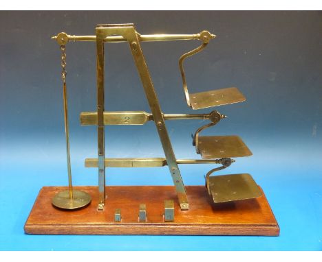 A three tier GPO ladder postage scale by Degrave & Co London, stamped to lower beams and 4oz pan GP0 and broad arrow, the bas