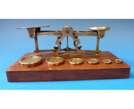 A set of S Mordan & Co postage scales with 1p to 8p weights and  ¼ oz and 2 dram weights to base