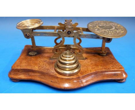 A set of Austin, St Andrew Street, Dublin postage scales, decorated all over with engraves scrolling decoration, on mahogany 