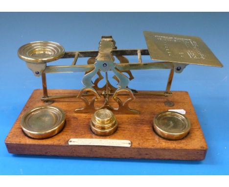 An S.Mordan & Co. brass postage scale with weights to base 