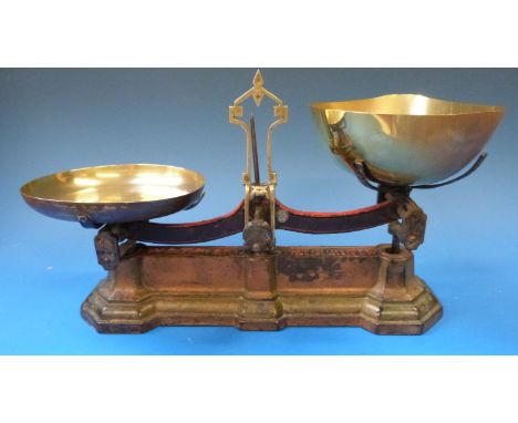 A set of 19thC W & T Avery 4lb counter top scales with cast iron base and brass pans 