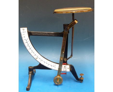 An unusual dual scale pendulum scale marked concav, the scales for 4oz and 18oz, height 24cm