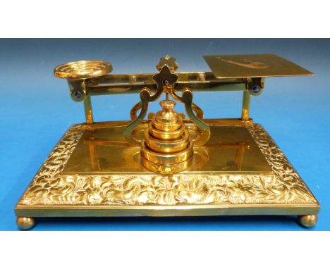 A set of probably Mordan brass letter scales, the cast base decorated with dolphins