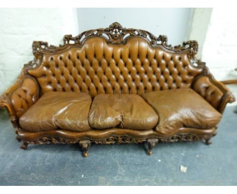 A 19thC style carved walnut and leather sofa and two side chairs (L213cm)