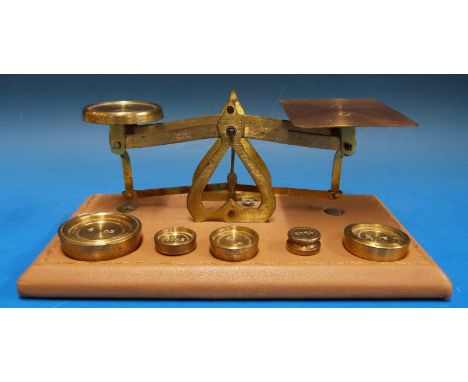 A set of possibly Setten & Durward postage scales on tooled leather base