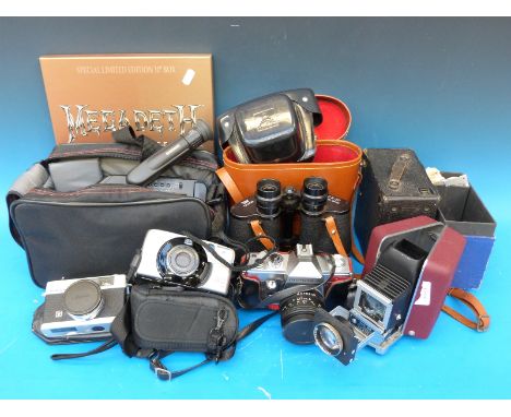 A quantity of cameras to include Samsung video recorder, Canon, Konica, Houghton-Butcher box camera, Telstar binoculars, Voig