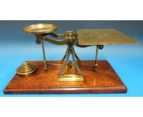 A set of De Grave Short & Fanner postal scales, on a rectangular mahogany base