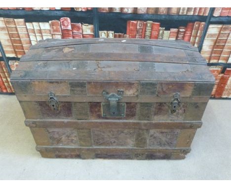 A vintage ash and metal bound domed steamer trunk, with fall flap container within the lid (L82 x W48 x H58cm) 