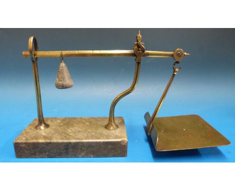 A set of Avery cantilever letter scales on grey marble base