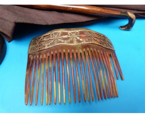 A 9ct gold mounted horn hair comb, child's parasol and an ivory candlestick