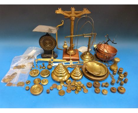 Two stacks of curved edge flat stacking weights together with a large selection of postal, troy and other brass weights inclu