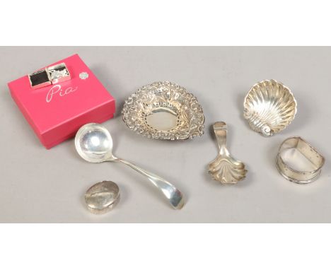 A collection of mostly silver items to include napkin ring, ladle etc.