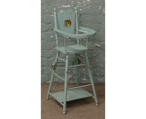 A vintage French painted childs high chair.