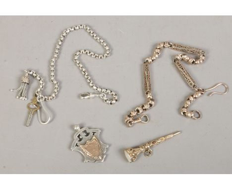 A Victorian Pinchbeck Albert chain and seal pencil fob, along with a silver and gilt shield fob and white metal Albert chain.