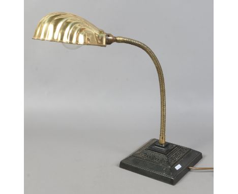 A 20th century adjustable brass reading lamp.