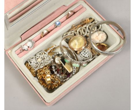 A jewellery case containing vintage costume jewellery including white metal and hardstone bangle, photo locket and cameos etc